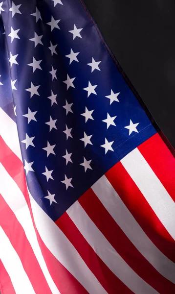 American Flag on the black. Vertical format of Background for Independence day or Veterans day.