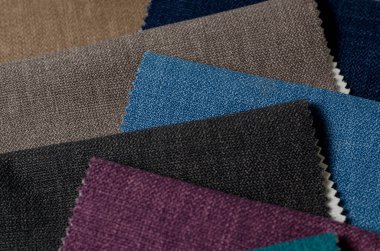 Parlak topçu tekstil örnekleri koleksiyonu. Çoklu renkli kumaş dokusu arkaplanı.