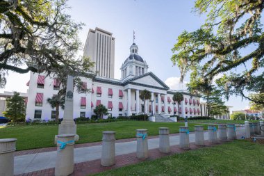 Tallahassee, Florida, USA - April 18, 2022: The Old Florida State Capitol, now a museum, with the new Capitol in the background