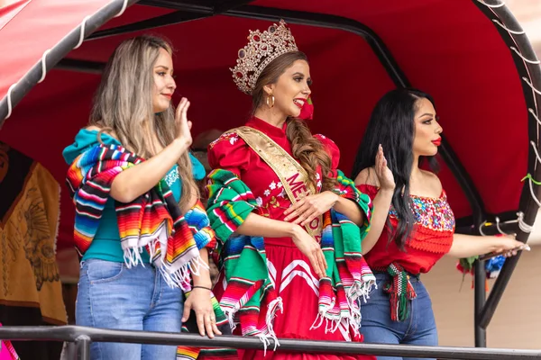 stock image Brownsville, Texas, USA - February 26, 2022: Charro Days Grand International Parade, Beauty queen riding a float with her friends during the parade