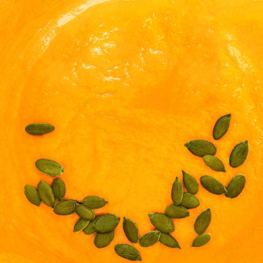 Squash soup  background. Autumn pumpkin  cream-soup closeup. wallpaper. Patter