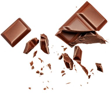 chocolate chunks isolated on white background. Flying Chocolate pieces, shavings and cocoa crumbs Top view. 