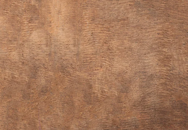 Dark Wood Texture with Scratches as a Background. Brown scratched wooden cutting board