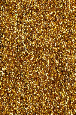 Noel kartı için altın parıltılı, ışıl ışıl arka plan. Işıltılı altın parıltılı ışıklar homurdanır