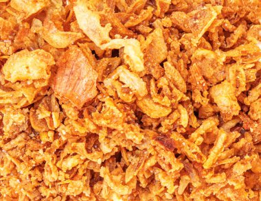 Kıtır kıtır kızarmış soğan, dokulu arka plan olarak. Kızarmış soğan, kızarmış soğan. 