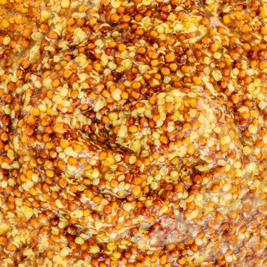 Hardal soslu dokular. Arka plan olarak sarı geleneksel Fransız Hardal sosu. Dijon hardalı dokusu. Desen