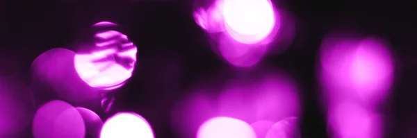 Blurred lights purple background, banner texture. Abstract bokeh with soft light header. Wide screen wallpaper. Panoramic web banner with copy space for design