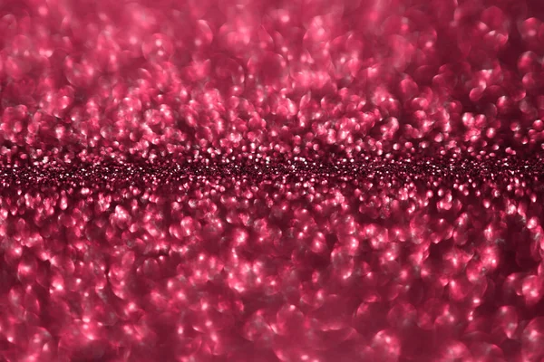 Viva magenta, pink sparkling glitter bokeh background, abstract defocused texture. Holiday romantic lights