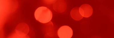 Blurred lights red background, banner texture. Abstract bokeh with soft light header. Wide screen wallpaper. Panoramic web banner with copy space for design