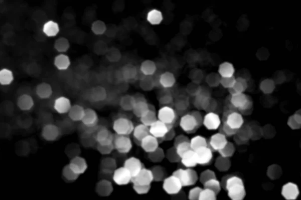 stock image White gray blurred bokeh lights on black background. Glitter sparkle stars for celebrate. Overlay for your design