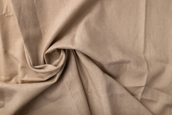 Естественная текстура льняной ткани. Флаксен круговой спиральный текстильный фон, вид сверху. Грубый крученый бурлап