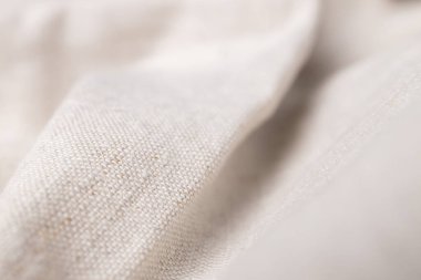 Doğal keten kumaş dokusu. Buruşuk buruşuk çuval bezi. Seçici odak