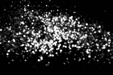White gray blurred bokeh lights on black background. Glitter sparkle stars for celebrate. Overlay for your design