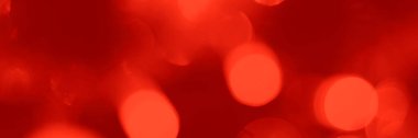 Blurred lights red background, banner texture. Abstract bokeh with soft light header. Wide screen wallpaper. Panoramic web banner with copy space for design