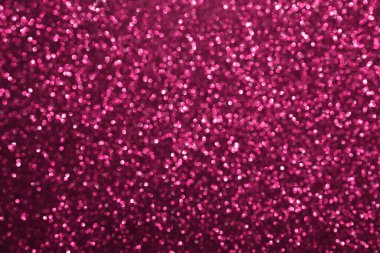 Pembe ışıltılı arka plan, sönmüş parlak ışıklar, soyut parlak doku. Tatil ışıkları.