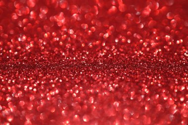 Kırmızı parıltılı arka plan, parlak ışık, soyut odaklanmış doku. Tatil ışıkları.