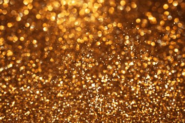 Altın parıltılı şenlik arkaplanı, soyut odaklanmış doku. Tatil ışıkları