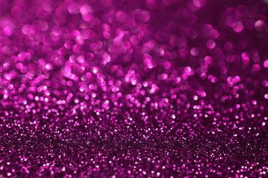 Pembe lacivert ışıltılı arka plan, sönmüş parlak ışıklar, soyut parlak doku. Tatil ışıkları.