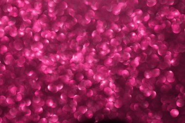 Pembe ışıltılı arka plan, sönmüş parlak ışıklar, soyut parlak doku. Tatil ışıkları.