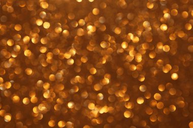 Altın parıltılı şenlik arkaplanı, soyut odaklanmış doku. Tatil ışıkları