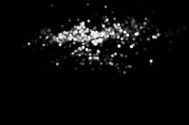 White gray blurred bokeh lights on black background. Glitter sparkle stars for celebrate. Overlay for your design