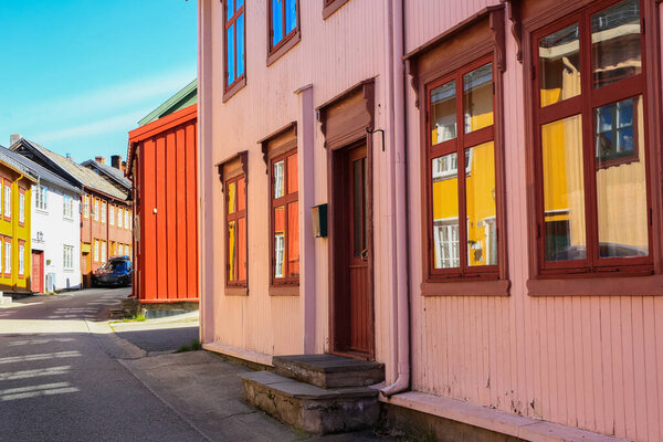 Street with old timber houses in Roeros. Roeros is a municipality in Troendelag county, Norway and also the mining town .