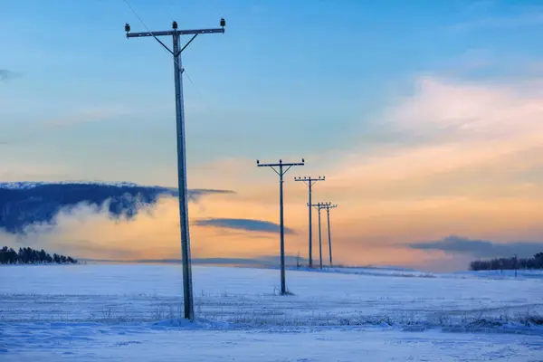 The view of the  high voltage electric line in the winter in Troendelag, Norway