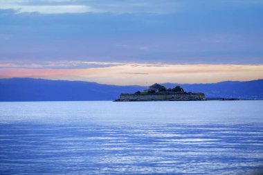 Sunset at Trondheim fjord, view of the island Munkholmen located near the Norwegian city Trondheim