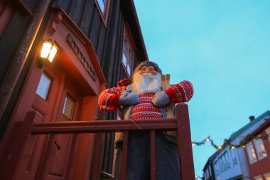 Christmas decoration with Santa Claus in the norwegian town Roeros (UNESCO World Heritage Site), installation  for Advent and Christmas clipart