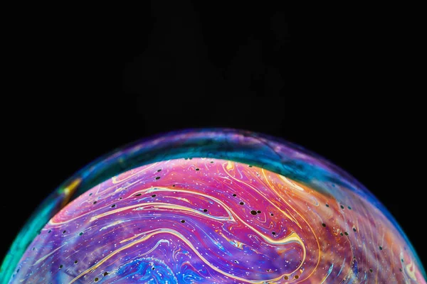stock image Virtual reality space with abstract multicolor psychedelic planet. Closeup Soap bubble like an alien planet on black background.