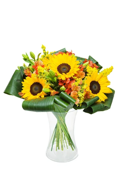 Beautiful huge bouquet of sunflowers with lilies in vase on white background.