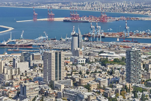 stock image Haifa, Israel - October 22, 2023: Seaport in the city of Haifa, panorama of the port and city buildings against the background of a blue sky with clouds.