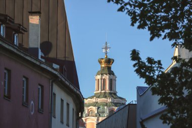 Vilnius old town street with the Church of All Saints at the end of it Jewish Ghetto streets