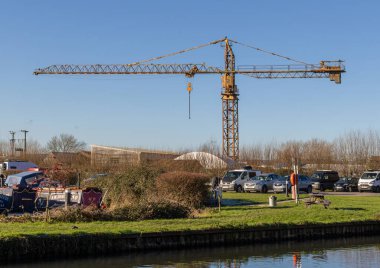 The tower crane of R.W. Davis and Son Ltd at Saul Junction where the Stroudwater Canal meets the Gloucester-Sharpness Ship Canal, Gloucestershire, United Kingdom clipart