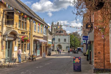 Dursley high street with 18th Century Town and Market Hall and Church of St James in the background, Gloucestershire, United Kingdom clipart