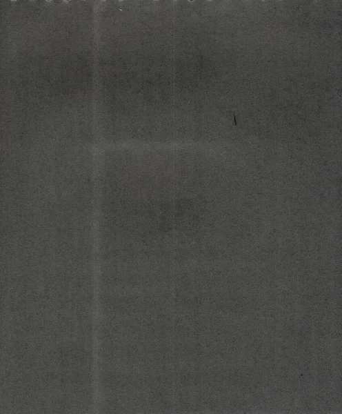 stock image A high-quality scan of an old black album paper, with dust and dirt, that could be used as a grunge texture or background.