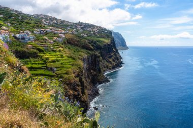 Scenic panoramic view from Miradouro de Sao Sebastiao on a summer morning, Madeira island, Portugal. clipart