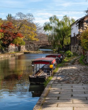 Scenic sight of Hachiman-bori canal in Omihachiman during fall season. Kansai region, Shiga Prefecture, Japan.