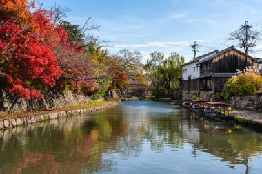 Scenic sight of Hachiman-bori canal in Omihachiman during fall season. Kansai region, Shiga Prefecture, Japan.