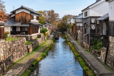 Scenic sight of Hachiman-bori canal in Omihachiman during fall season. Kansai region, Shiga Prefecture, Japan.