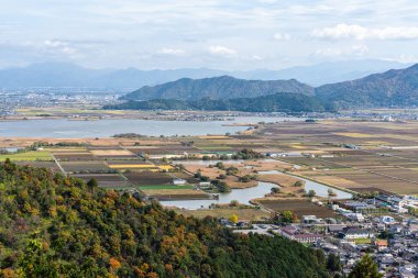 Panoramic view with Lake Biwa from Murakumo Zuiryu Temple in Omihachiman during fall season. Kansai region, Shiga Prefecture, Japan.