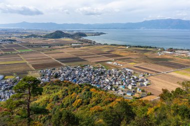 Panoramic view with Lake Biwa from Murakumo Zuiryu Temple in Omihachiman during fall season. Kansai region, Shiga Prefecture, Japan.