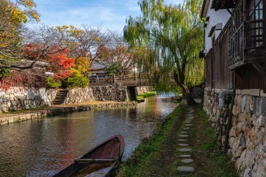 Scenic sight of Hachiman-bori canal in Omihachiman during fall season. Kansai region, Shiga Prefecture, Japan.
