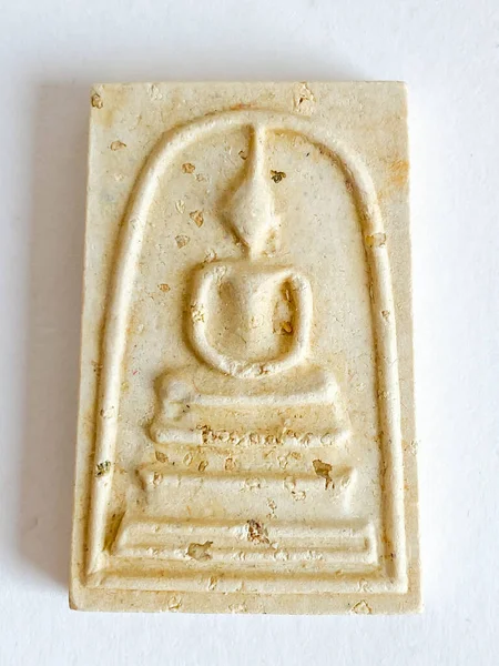 stock image Thai old buddha amulet on white background.