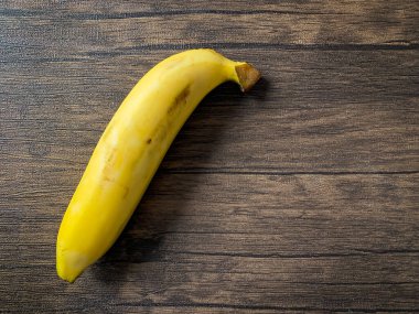 Golden Banana ready to eat on the wooden table 