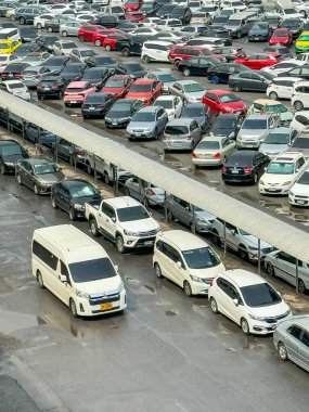 Bangkok Thailand - 11 May 2024: Cars parked at a park and side lot at a BTS Chatuchak station clipart