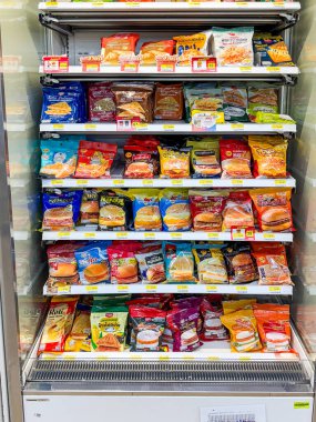 Bangkok, Thailand - 17 June 2025: Many types of burgers and sandwiches are ready to eat in the 7-Eleven in Bangkok