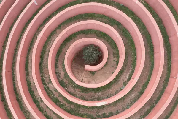 Aerial view of Labirinto Di Arianna maze, Sicily, Italy. Between Palermo and Messina is a real spiral labyrinth inspired by the Greek myth of Theseus and Ariadne.