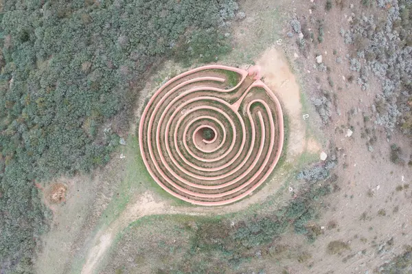 Aerial view of Labirinto Di Arianna maze, Sicily, Italy. Between Palermo and Messina is a real spiral labyrinth inspired by the Greek myth of Theseus and Ariadne.