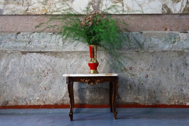 vintage vase with flowers on the table